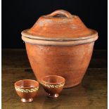 A Sussex Lead Glazed Redware Bread Crock, Circa 1870's; the turned lid with strap handle.