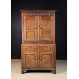 An 18th Century Welsh Joined Oak Cupboard in two sections.