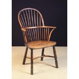 A 19th Century Yew-wood Stick-back Windsor Armchair.