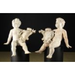 A Pair of 18th Century Carved & Painted Putti.