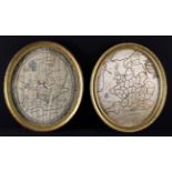 Two George III Oval Embroidered Silkwork Maps set in gilt frames;