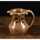 A Yorkshire Pottery Puzzle Jug, 6¼ in (16 cm) in height.