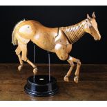 An Articulated Wooden Lay Horse with hair tail,