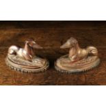 A Similar Pair of 19th Century Salt-glazed Stoneware Reclining Lurcher Dogs on oval bases,