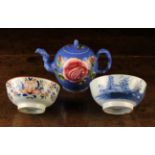 An 18th Century Creamware Teapot (A/F) and two Delft bowls: The teapot having a globular body with