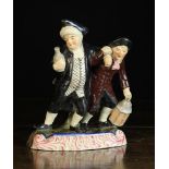 A 19th Century Staffordshire Figure Group; Vicar & Moses, on a scrolling base, 8½ ins (21.