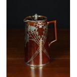 A Fine Brown Glazed Ceramic Jug with lid decorated with engraved sterling silver overlay;