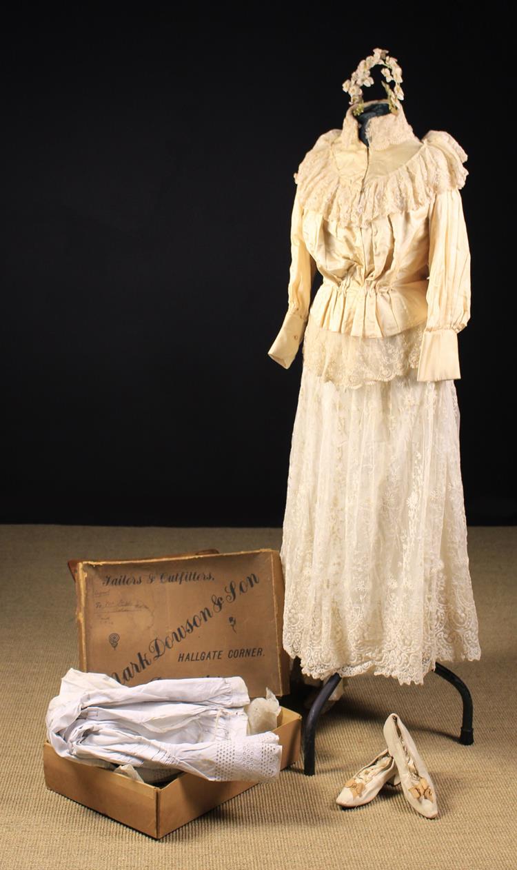 An Antique Wedding Outfit: A hand made cream high-necked jacket with lace trim & a matching