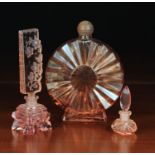 A Group of Three Art Deco Peach Glass Scent Bottles.