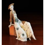 A Katzhütte Porcelain Art Deco Style Figure of an elegant lady reclining on a pedestal with a