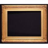 A 19th Century Gilt Gesso Picture Frame with trailing foliage adorning the corners, and a gilt slip,