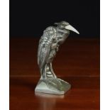 A French Art Deco Silvered Bronze Heron with carved ivory bill signed on back MANIN,