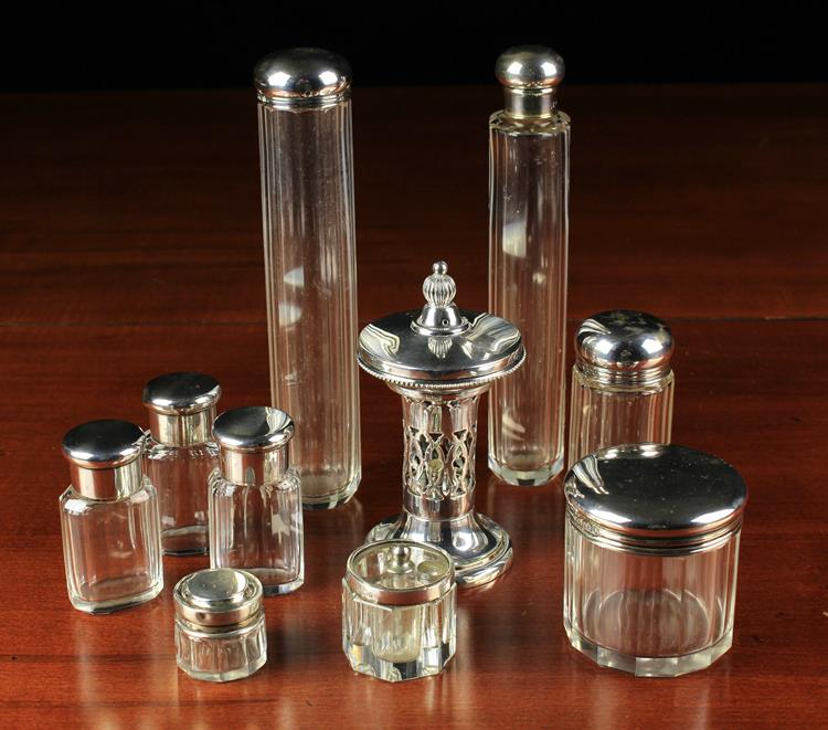 A Group of Seven Silver topped Vanity Jars & Bottles by Mappin & Webb and A Small & Unusual Silver