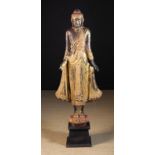 A 19th Century Lacquered & Gilded Wooden Carving of Bodhisattva depicted standing on a lotus flower