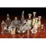 A Collection of Cut & Moulded Glass Scent Bottles, some silver mounted.