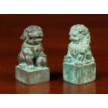 Two Small Antique Chinese Bronze Scroll Weights cast in the form of Dogs-of-Fo sat on square bases,