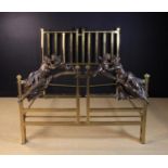 A 19th Century Brass Bed with Figural Bronze Mounts.