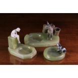 Three Green Onyx Marble Ashtrays: One mounted with a carved ivory figure of a seated nude raised on