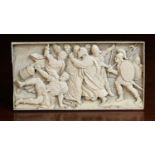 A 19th Century Ivory Plaquette finely carved in sunken relief with brawling figures,