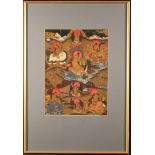 An Antique Tibetan Thangka painted in gouache on fabric with deities and figures riding on the