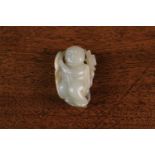 A Late 18th/Early 19th Century Jade Carving; one of the Hehe twins. 2 in (5 cm) in length.