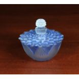 A Lalique Scent Bottle of pale blue tinged frosted glass moulded as a lotus flowerhead with a seed