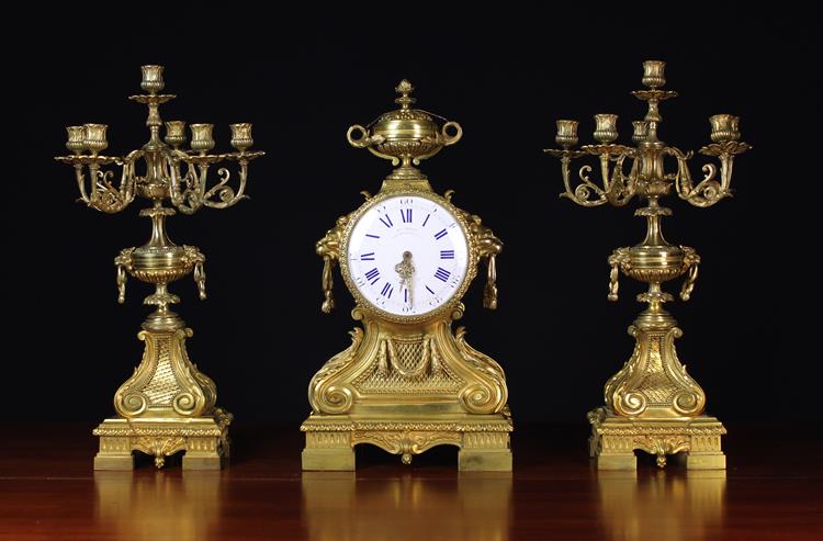 A Splendid and Rare 19th Century Gilt Bronze Double-faced Clock Set in the Louis XVI Style.