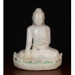 A Fine Antique Quartz Carving of Buddha sat upon lotus leaves with remnants of green paint to the