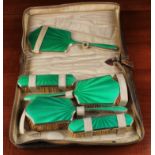 A Fine Art Deco Silver & Vibrant Green Guilloché Enamelled Brush Set by Albert Carter,