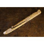 A 19th Century Chip Carved Treen Knitting Sheath, 7 in (18 cm) in length.