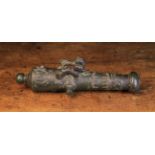 A Rare 17th Century Miniature Bronze Cannon cast with two lions and ornamentation to the barrel,