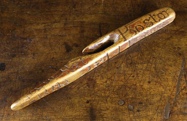 A 19th Century Treen Knitting Sheath naively carved with decoration,