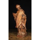 An 18th Century Carving of Saint Thomas Becket wearing a mitre & bishop's robes,