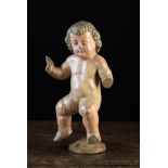 An 18th Century Polychromed Wood Carving of a Cherub, 12 ins (30 cm) in height,