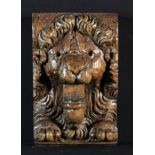 A 17th Century Flemish Oak Appliqué carved with a roaring lion's mask, 8 in x 5 in (20 cm x 12.