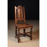 An Early 18th Century Joined Oak Side Chair (A/F) having a dome topped fielded back panel beneath a