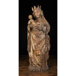 An Early 16th Century Style Sculpture carved in high relief with The Virgin & Child.