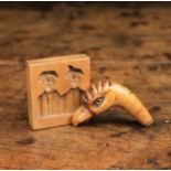 A Small Square Treen Culinary Mould carved with two figures from German Folklore, "Max and Moritz",