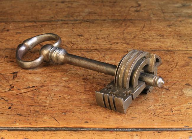 A 17th Century Key with intricate locking mechanism, probably an apprentice piece, 6½ in (16.