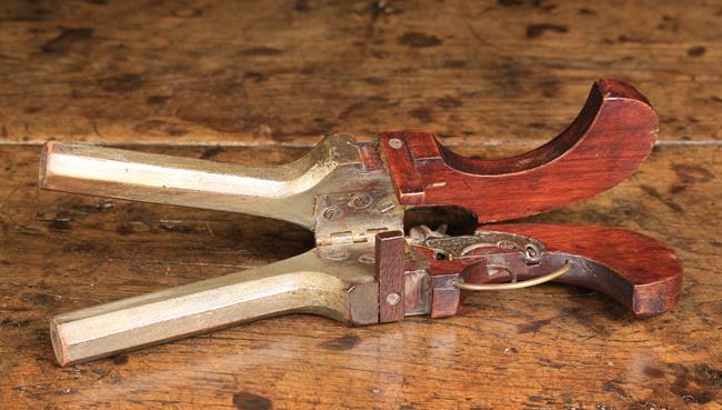 A 19th Century Metamorphic Mahogany Shoe Jack carved in the form of a double barreled pistol hinged - Image 2 of 2