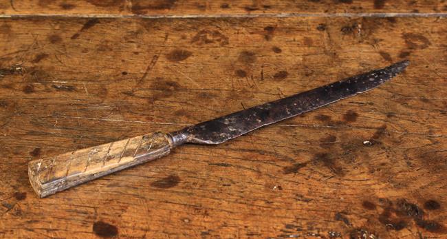 A 17th Century Domestic Knife with steel blade on horn handle punched with small roundel