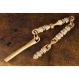 A Rare Antique Treen Knitting Sheath threaded onto a chain of intricately carved links worked from