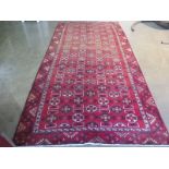 A hand knotted woolen Turkman rug - 2.94m x 1.48m - fade to one end