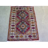 A hand knotted woolen Pushti rug - 0.88m x 0.61m