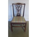 A Georgian mahogany single chair with a carved back splat