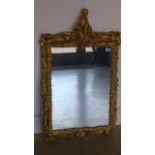 A Victorian carved wood gilded frame Italian Viennese wall mirror surmounted by a cherub - 93cm x