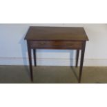 A mahogany side table, single drawer raised on square tapering supports - 80cm x 44cm x 72cm