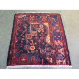 A hand knotted woolen Hamadan rug - 1.08m x 1.00m