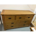 An ex display oak 3 + 4 chest