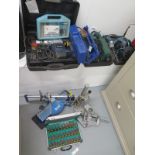 A selection of 4 power tools and attachments and a boxed set of Routers, 1 drill and 3 sanders, a